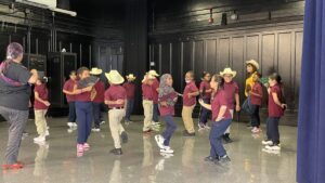 Students learning a Mexican dance