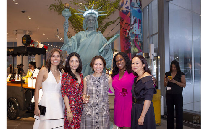 Board members with live Statue of Liberty